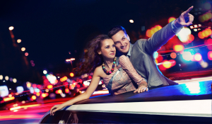 couple traveling a limousine at night
